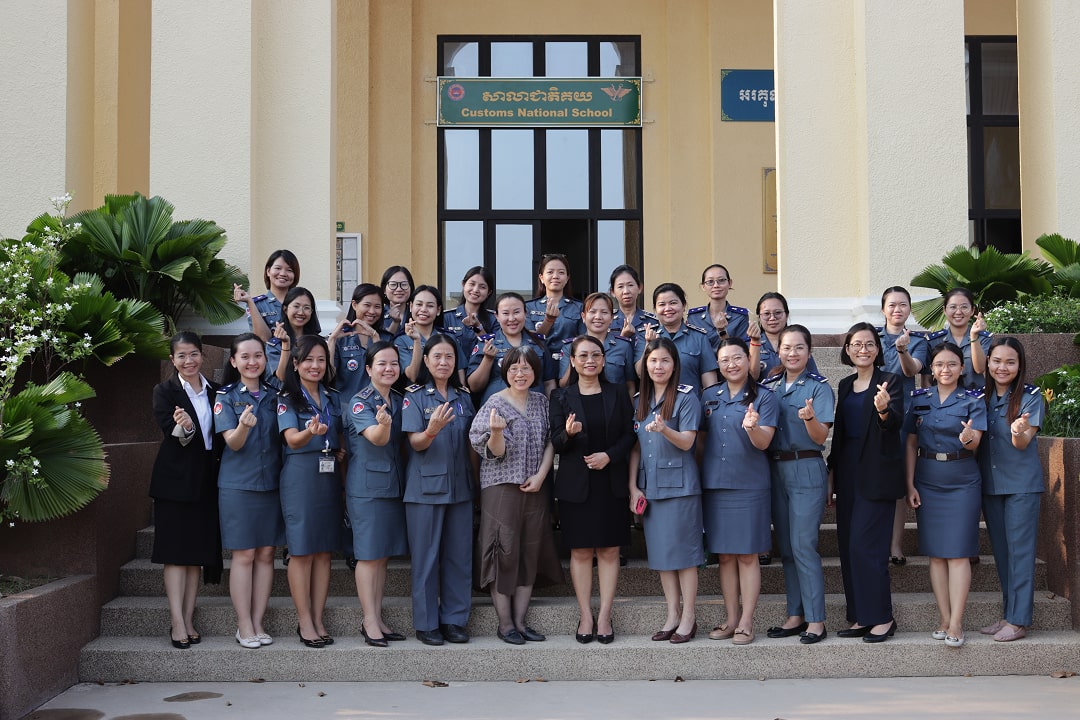 A group of smiling women posing for a photo together.