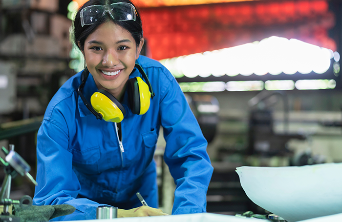 Professional Female Engineer wearing safety goggles 
